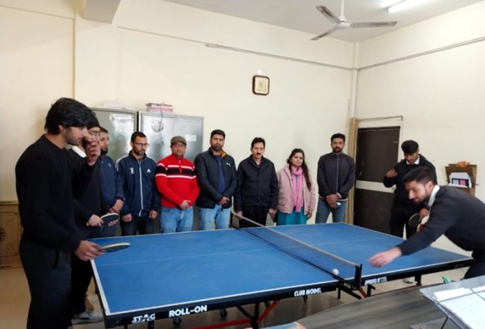 Players in action during a table tennis match at Government Degree College Nowshera.