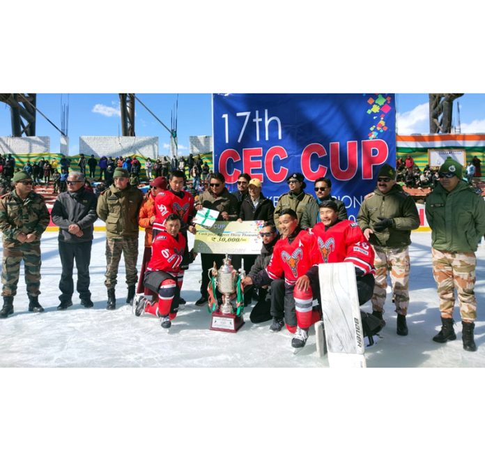 Chief Guest presenting trophy and cheque to a winning team at Leh on Thursday.