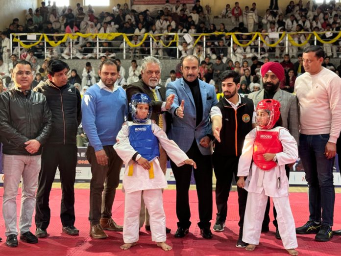 Ranjeet Kalra, Member J&K Sports Council along with others posing during opening ceremony of 26th J&K-UT Taekwondo Championship at Jammu. 