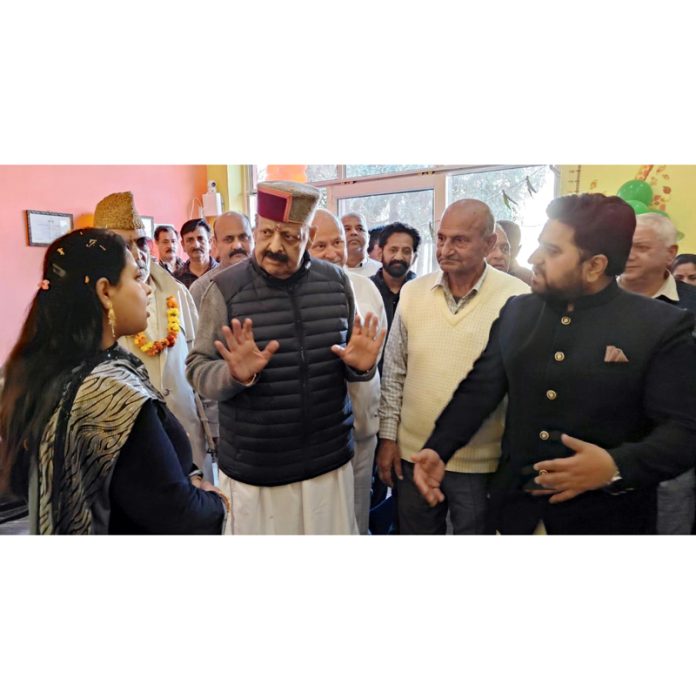 Senior BJP leader Devender Singh Rana interacting with teachers at Nagrota.