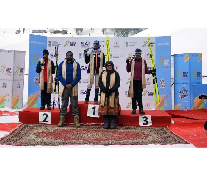 Winners posing with medals on podium during award ceremony at Gulmarg on Thursday. —Excelsior/Aabid Nabi