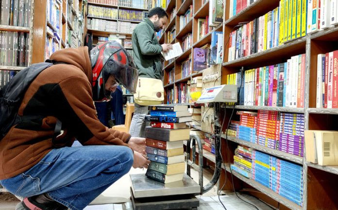 Books being sold in kilograms at a bookshop in Srinagar on Tuesday. —Excelsior/Shakeel