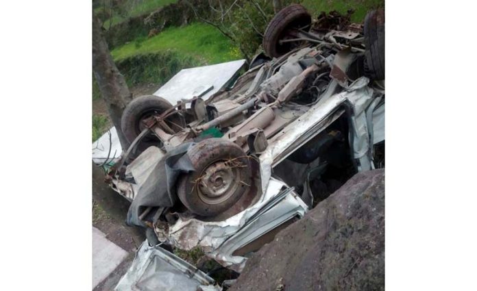 Wreckage of car lying in gorge after accident.