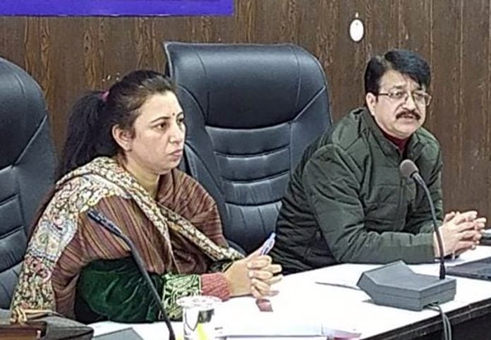 Commissioner State Taxes Department chairing a meeting.