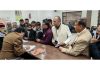 Senior BJP leader Devender Singh Rana hearing public grievances at party headquarters.