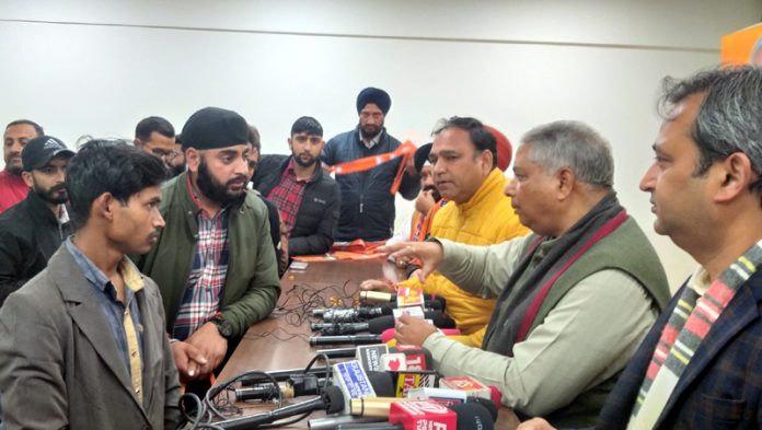 Former Minister and ex president BJP Sat Sharma listening public grievances at Jammu on Wednesday.