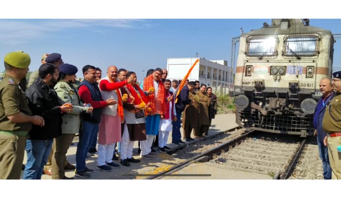 MP Jugal Kishore Sharma flagging off pilgrims train to holy city of Ayodhya from Jammu on Tuesday.