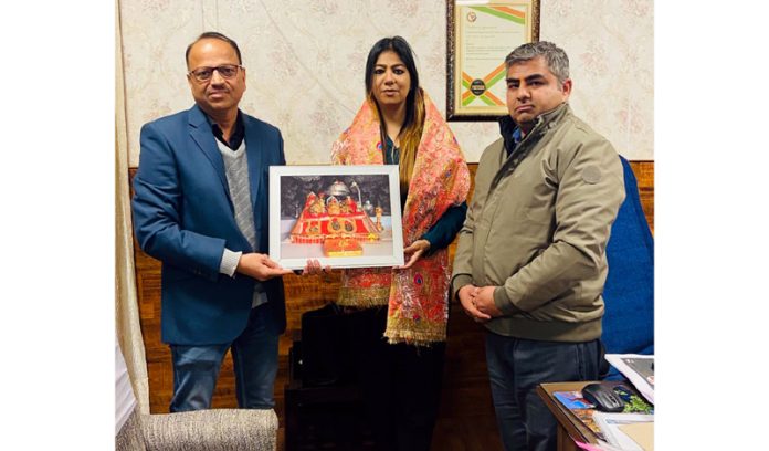 President & general secretary of Chamber of Tourism Trade & Industry Katra presenting Mata Ki Chunari & photo to Yasha Mudgal.