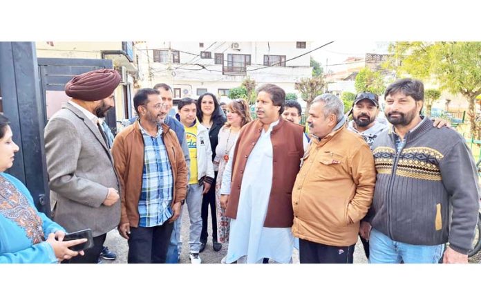 Senior Cong leader Raman Bhalla interacting with people in Bahu area of Jammu on Friday.