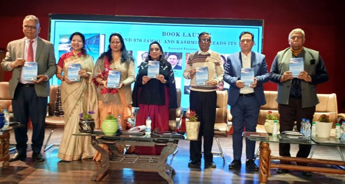 Ritu Singh along with others launching a book during a function in Jammu on Tuesday.