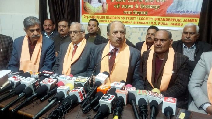 Chairman, Shri Guru Ravi Dass SS Trust, C L Banal, flanked by others addressing a press conference in Jammu.
