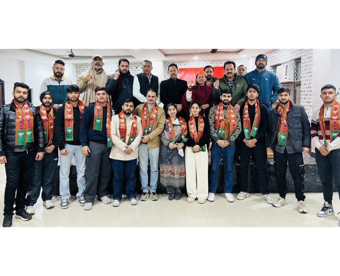BJP leaders posing for a photograph with new entrants in the party during a function at Jammu on Sunday.