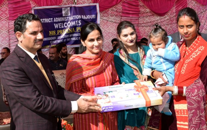 Commissioner Secretary distributing baby care kits during Beti Bachao Beti Padhao campaign on Tuesday.