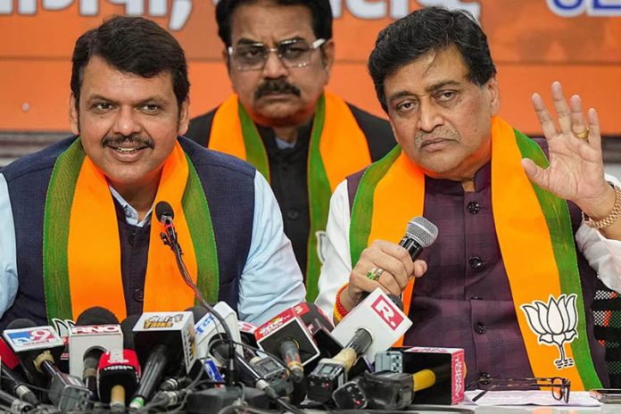 Former Maharashtra CM and Congress leader Ashok Chavan with Maharashtra Deputy Chief Minister Devendra Fadnavis addresses media after joining BJP, in Mumbai.