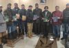 College Principal and others releasing the books authored by Dr Shavish Vaid at Rajouri College.