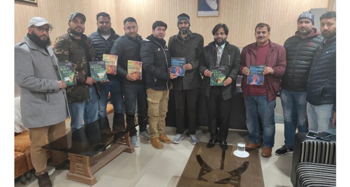 College Principal and others releasing the books authored by Dr Shavish Vaid at Rajouri College.