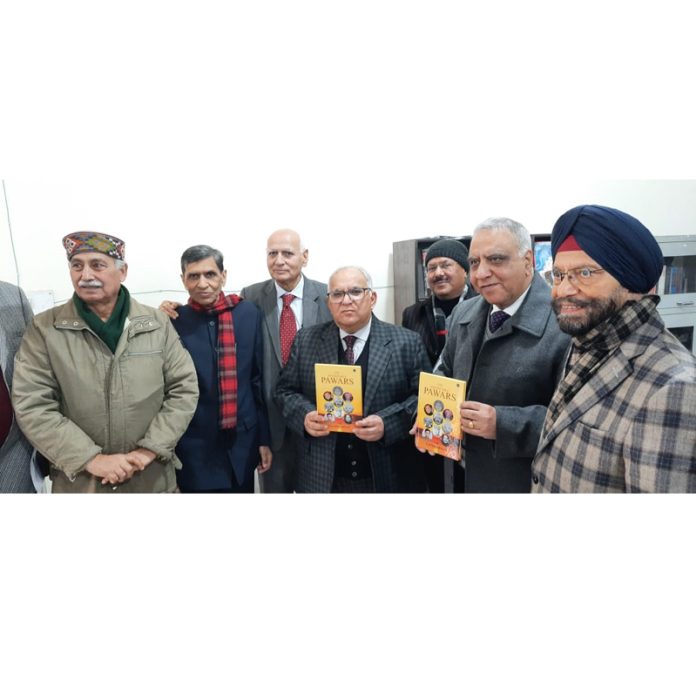B R Sharma, State Election Commissioner and Dr Ashok Bhan releasing a book in Jammu on Sunday.