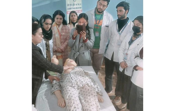 A doctor and students during a practical workshop on screening of breast cancer.