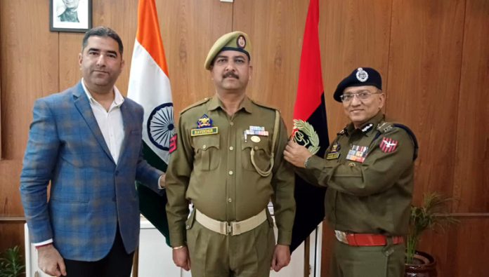 ADGP Jammu, Anand Jain, pinning rank to the newly promoted HC at ZPHQ Jammu on Wednesday.