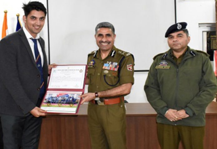 ADGP Garib Dass presenting a certificate to an officer during the conclusion of a course on cyber crime at SKPA Udhampur on Monday.