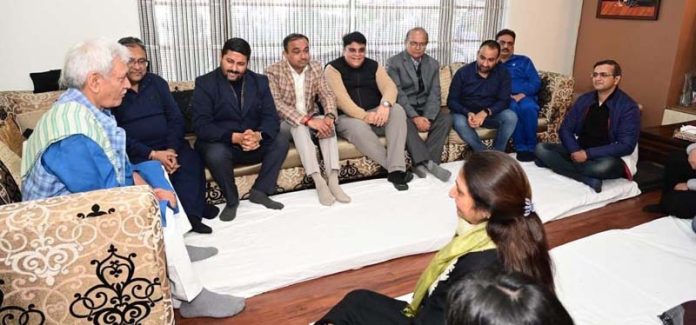 LG Manoj Sinha and senior administrative officers at Gaurav Gupta's residence in Jammu.