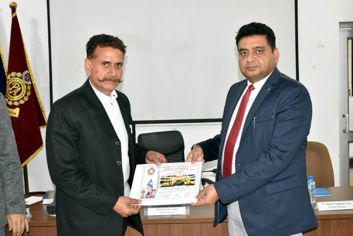 Rajinder Kumar Gupta, Deputy Director (Indoors), SKPA, providing a certificate to an officer during a training programme in the academy on Wednesday.