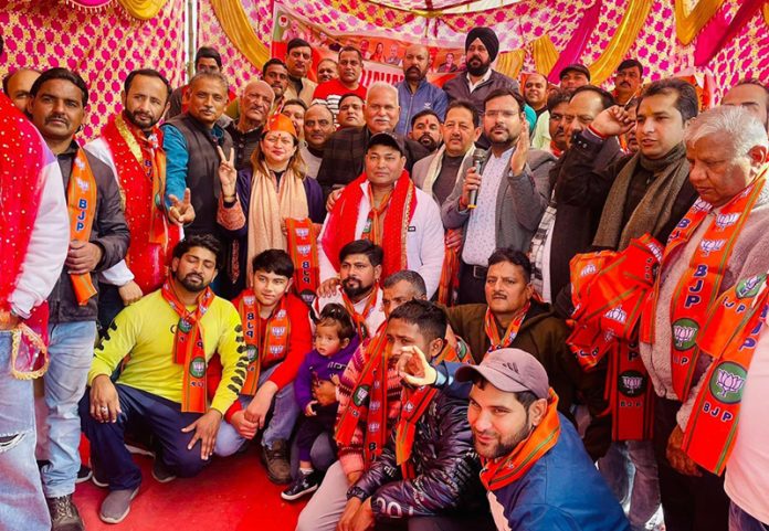 BJP District President Jammu South Rekha Mahajan along with the people, who joined the party in Jammu on Thursday.