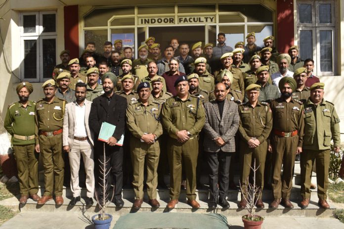 Police personnel posing for a group photograph at the start of a training programme in PTTI Vijaypur on Thursday.