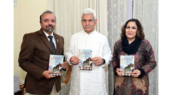 LG Manoj Sinha releasing Col A K Raina’s book.