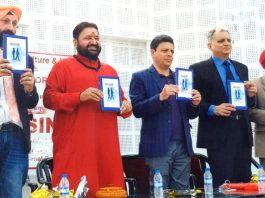 Dignitaries releasing a book of poetry in Jammu.