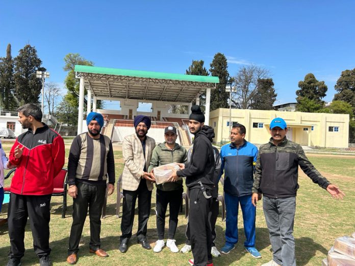 J&K Sport's Council officials presenting sports kits among trainees of Khelo India Centres Poonch.