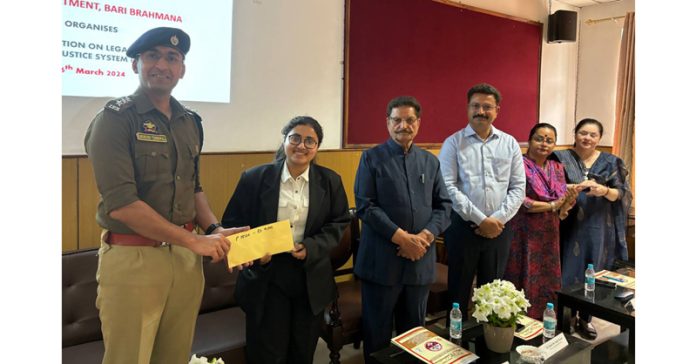 Mukund Tibrewal, SDPO, Bari Brahmana presenting certificate to a Law student.