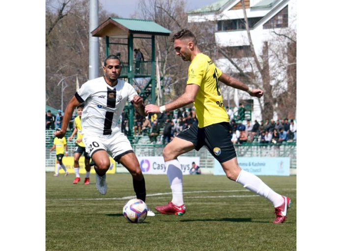 Players in action during a football match at TRC Ground, Srinagar on Saturday.