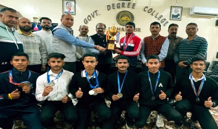 Principal GDC Udhampur Prof (Dr) Romesh Kumar Gupta presenting awards to medal winners on Friday. 