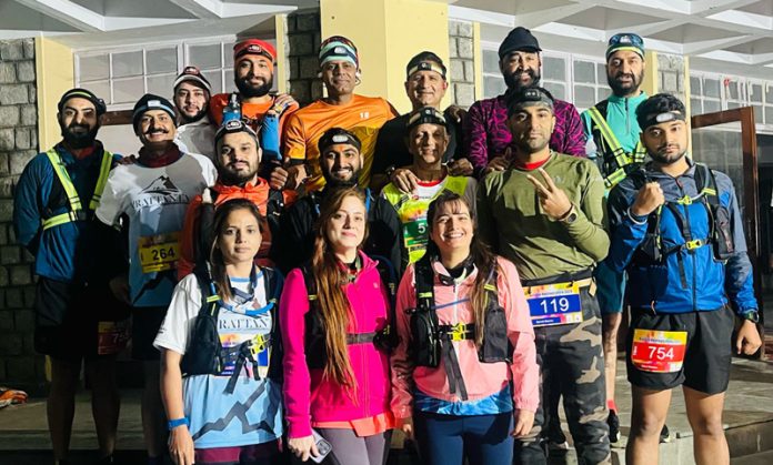 Runner of Jammu and Kashmir posing for group photograph during Kangra Heritage Marathon. 