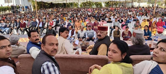 BJP leaders, Pawan Gupta and DS Rana (in the middle on the stage), posing for a photograph during observation of 16th death anniversary of Lala Shiv Charan Gupta in Udhampur on Sunday.