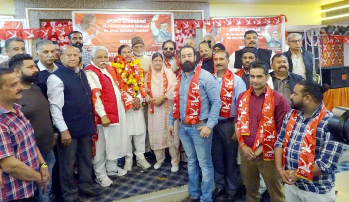 NC's addl general secretary Ajay Sadhotra and other leaders with newly joined former BJP Corporator Satpal Karloopia in Jammu. -Excelsior/Rakesh