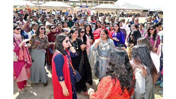 Jawans along with their families during 'Holi Mela' at BSF's Humhama Campus on Sunday. -Excelsior/Shakeel