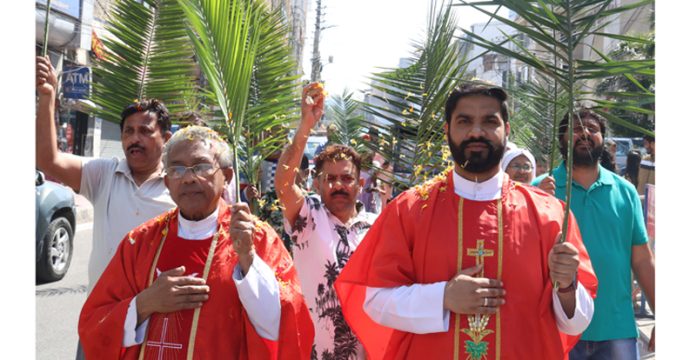 Members of Christian community during Palm Sunday procession in Jammu. -Excelsior/Rakesh