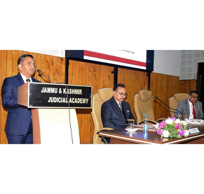 Justice Sanjeev Kumar addressing 2 day training prog on 'New Criminal Laws' at Srinagar on Saturday.