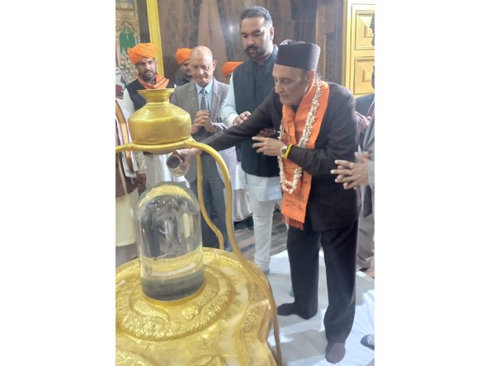 Dr Karan Singh along with Ranvijay Singh paying obeisance at the Natraj Temple in Jammu on Monday.