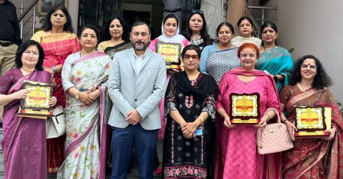 Dignitaries posing for a group photograph at a programme on 'Women Empowerment' in Jammu on Wednesday.