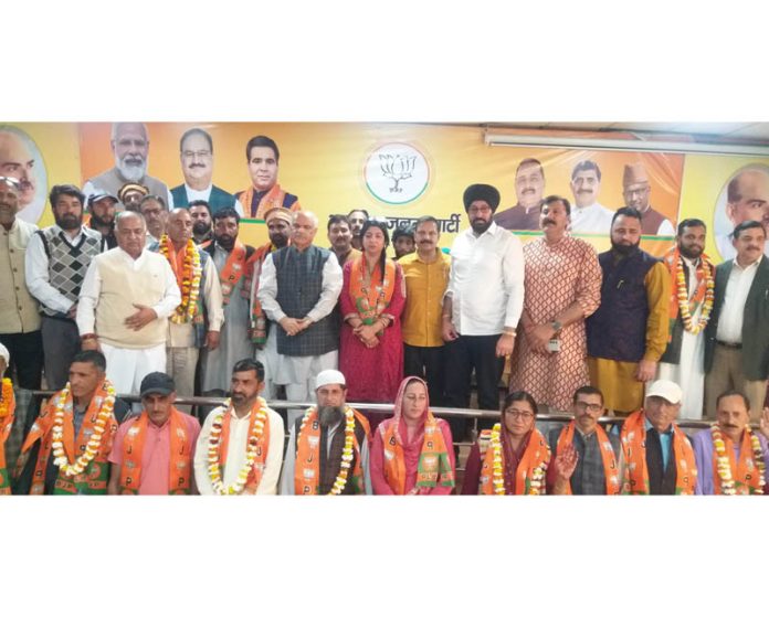 The political leaders from various parties who joined BJP posing for a photograph with party general secretary (Org), Ashok Koul, former MLA Balwant Singh Mankotia and other leaders at Jammu on Wednesday.