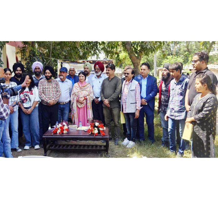 Dignitaries posing for a group photograph on culmination of Sculptors’ Camp at Kala Kendra in Jammu on Wednesday.