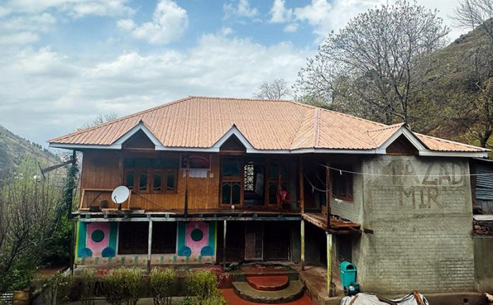 Police attached a two-storeyed residential house owned by drug peddler in Baramulla district on Saturday.