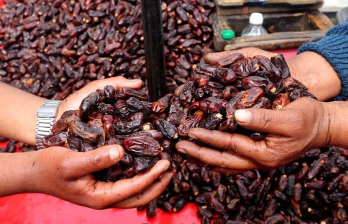 A variety of dates exported from several foreign countries hit the markets ahead of the holy fasting month of Ramadhan in Kashmir (UNI).