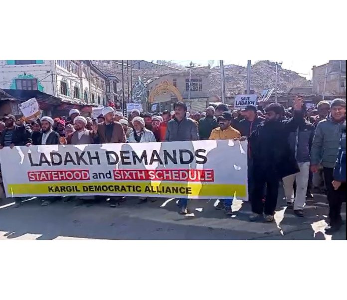 People taking out a protest march in Kargil on Wednesday. -Excelsior/Basharat Ladakhi