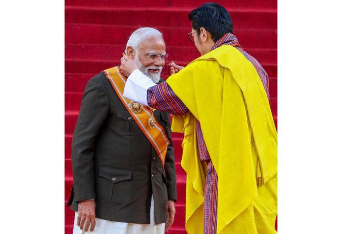 Prime Minister Narendra Modi being conferred with the ‘Order of the Druk Gyalpo’, Bhutan’s highest civilian award by Bhutan's King Jigme Khesar Namgyel Wangchuck, at the Tendrelthang, Thimphu on Friday. (UNI)
