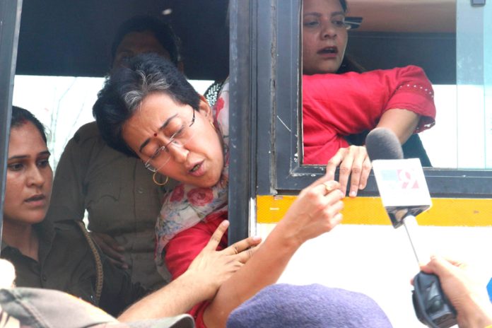 AAP leader Atishi Marlena Singh being detained during a protest at ITO against the arrest of Delhi Chief Minister Arvind Kejriwal by the ED in New Delhi on Friday. (UNI)