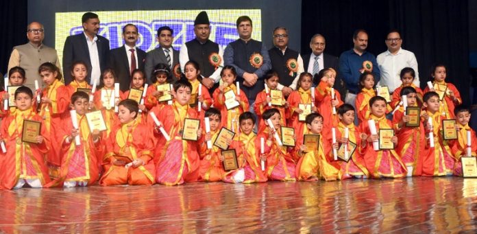 Member of Parliament (Rajya Sabha), Ghulam Ali Khatana posing along with students during a programme on Thursday.